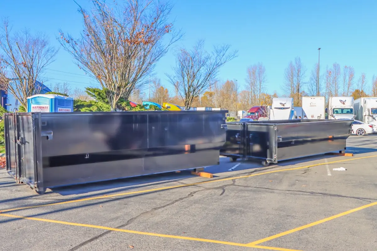 Professional dumpster rental service with roll-off container on residential driveway in Steiner Ranch